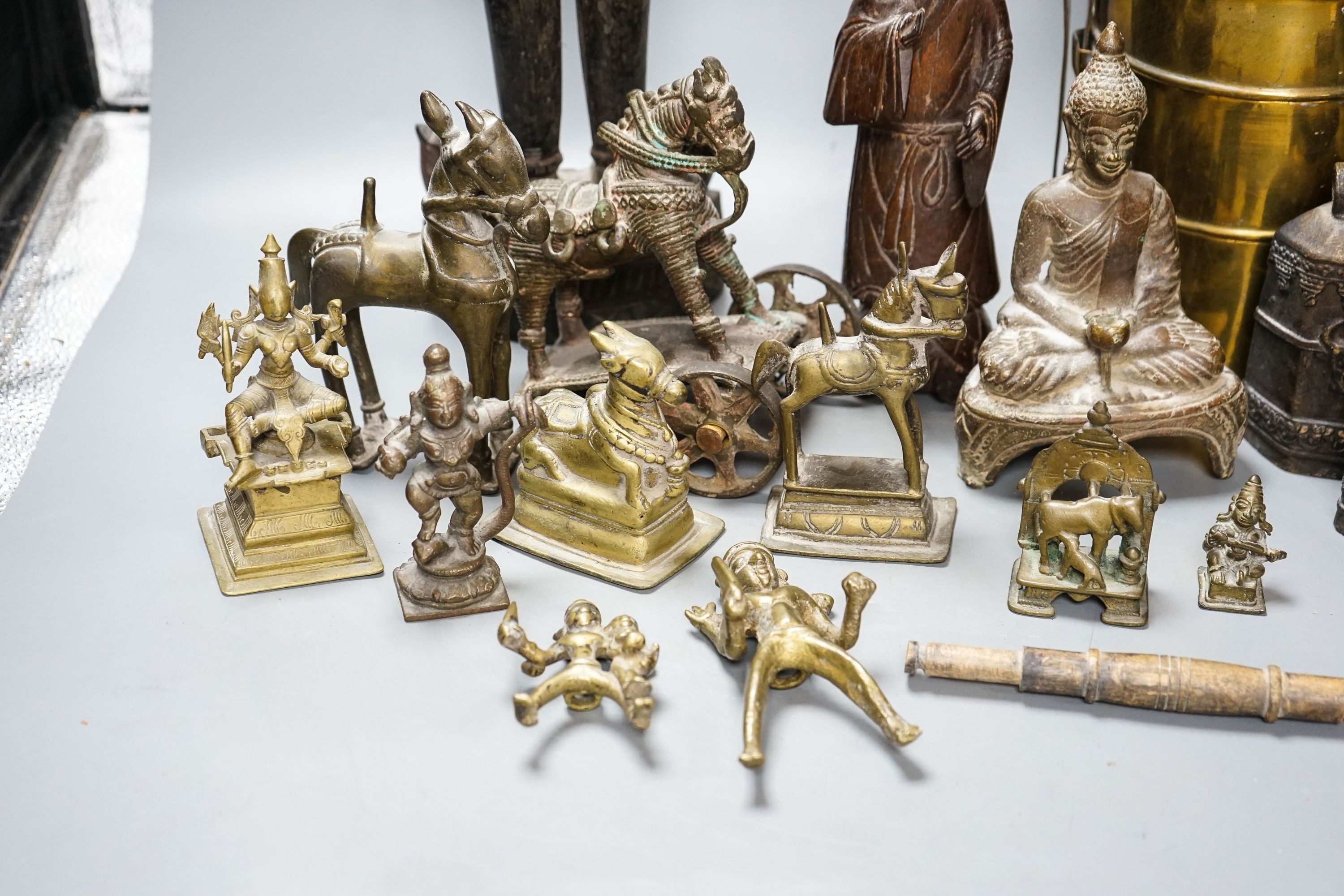 A group of Indian brass and wood figures and a Chinese wood figure